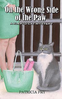 On the Wrong Side of the Paw: A Klepto Cat Mystery